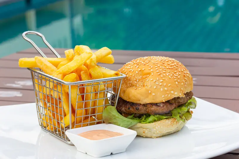 Burger with fries and dipping sauce
