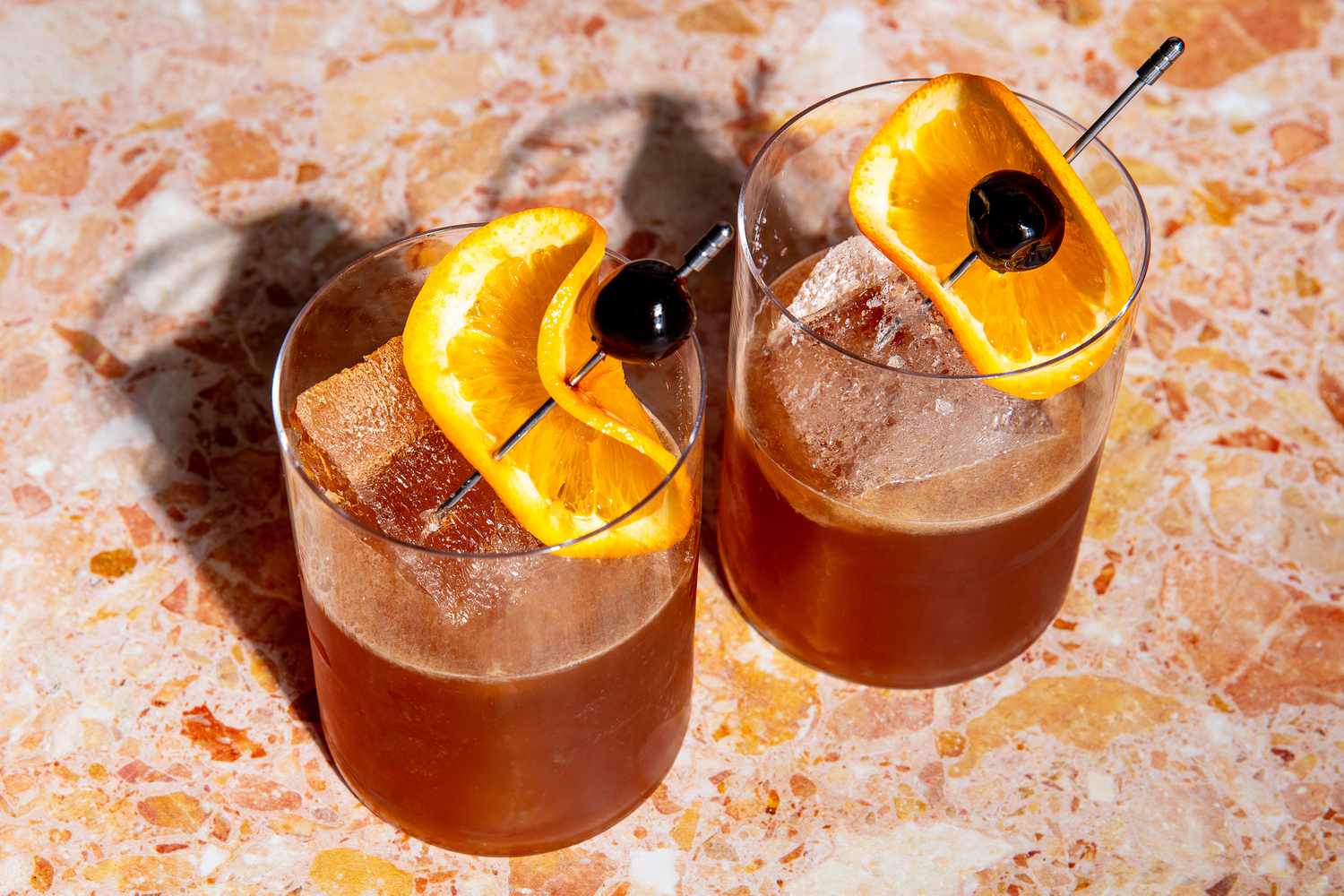 Whiskey cocktails with orange peel